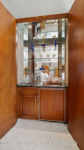 a spacious bathroom with a granite countertop sink and a large mirror