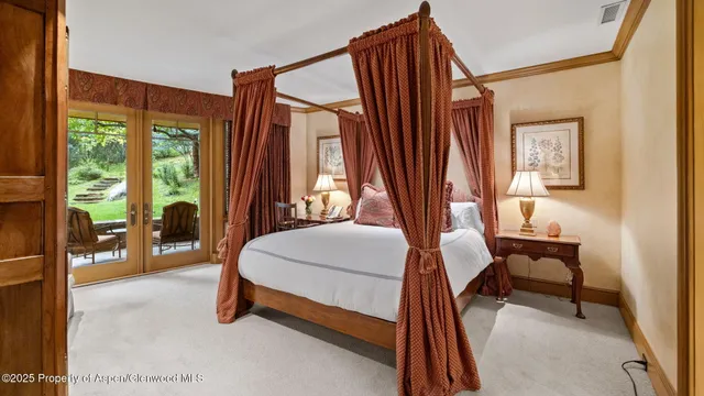 a bathroom with a granite countertop sink and a large mirror