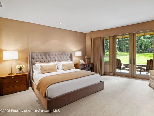 a view of a brick house with a chairs