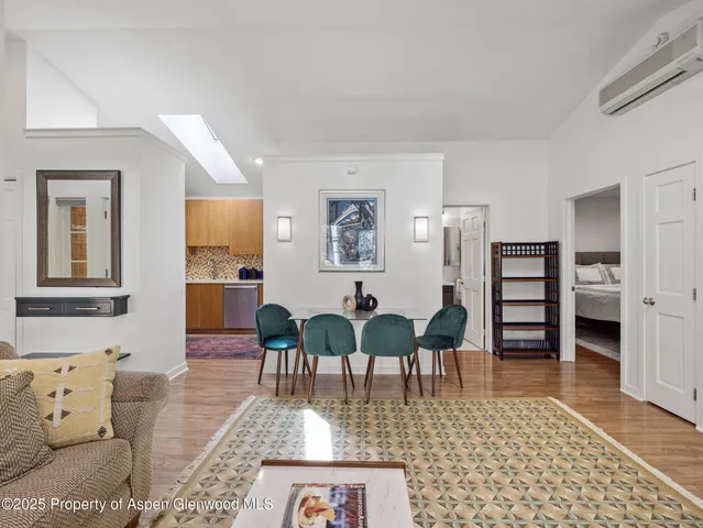 a view of balcony with two potted plant and outdoor seating