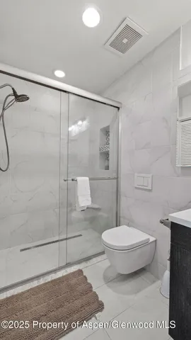 an aerial view of a house with yard