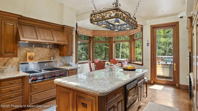 a dining room with furniture window and outside view