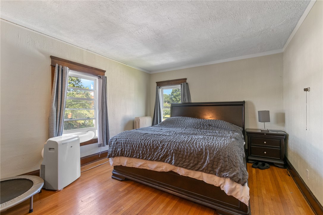1960 Ridge Road Ontario, NY 14519 - Photo 26 of 43 LARGE bedroom with gleaming hardwoods!