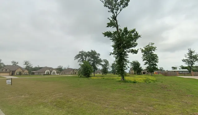 a view of a lake with a big yard