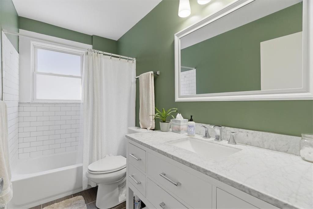 246 Dunseith Street Pittsburgh, PA 15213 - Photo 17 of 36 a bathroom with a sink a toilet and shower