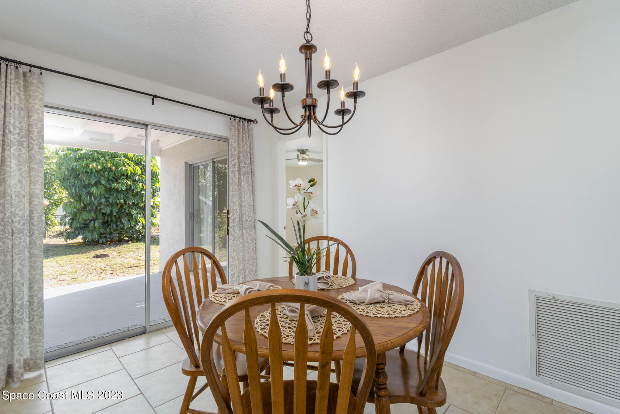 2095 Montgomery Road Melbourne, FL 32935 - Photo 14 of 25 a view of a dining room with furniture window and outside view