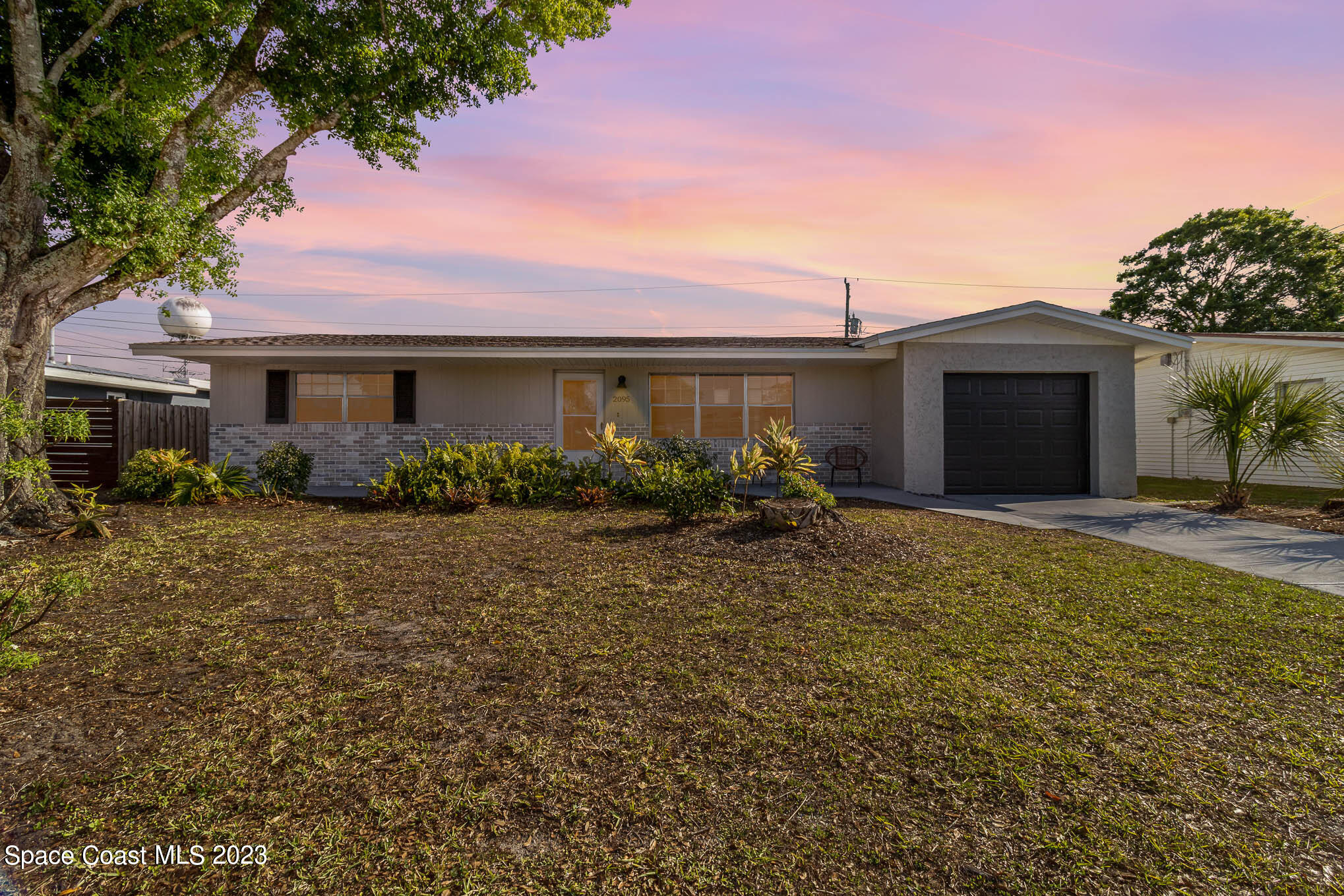 2095 Montgomery Road Melbourne, FL 32935 - Photo 23 of 25 a front view of house with yard and green space