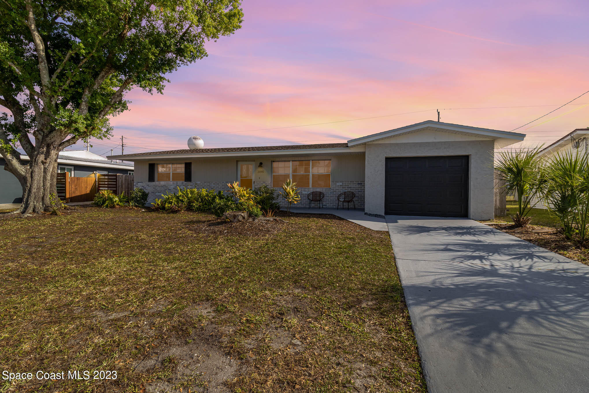 2095 Montgomery Road Melbourne, FL 32935 - Photo 25 of 25 a front view of a house with garden