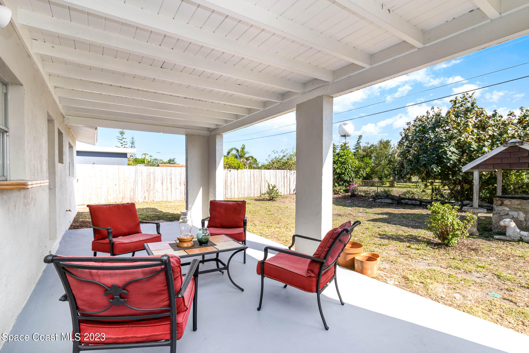 2095 Montgomery Road Melbourne, FL 32935 - Photo 3 of 25 a living room with patio furniture and a large window