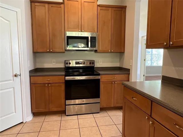 a kitchen with a stove and a microwave