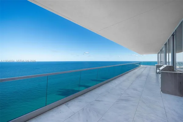 a living room with furniture floor and a flat screen tv