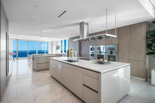 a bedroom with a bed and a lamp