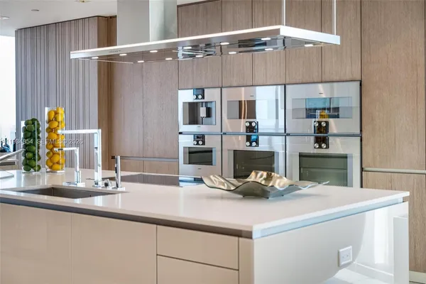 a bedroom with a bed and a night stand