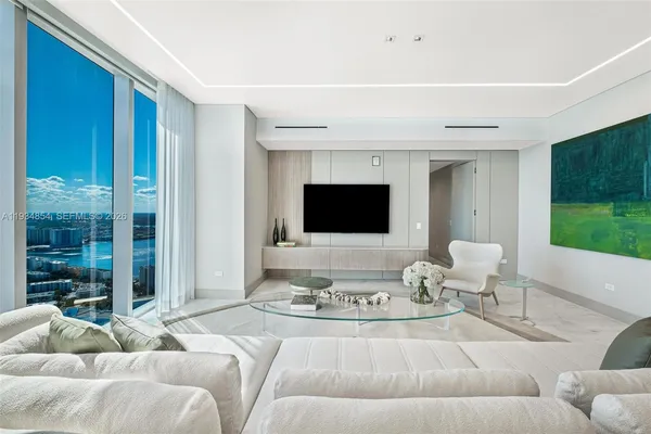 a bedroom with a bed and a chair