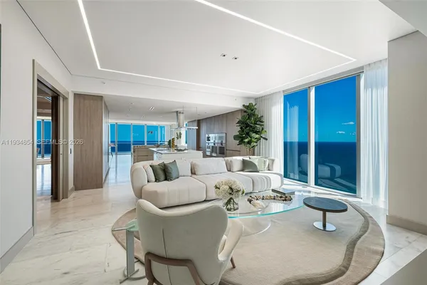 a view of an empty room with a staircase