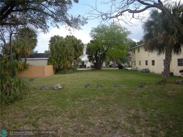 a view of a trees in front of a house