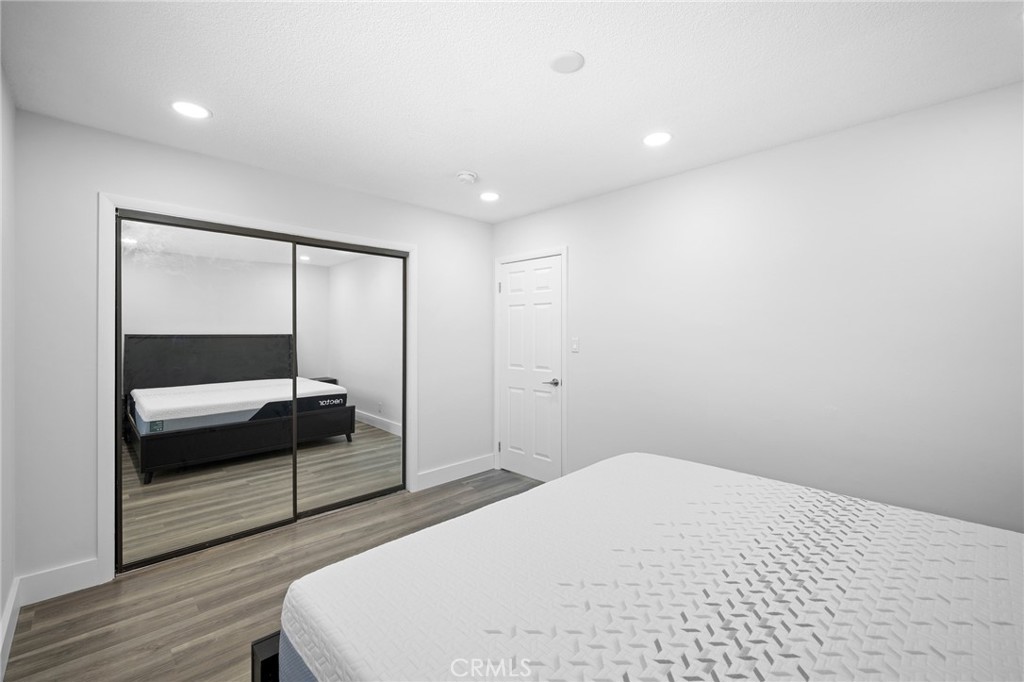 7231 Apperson Street Tujunga, CA 91042 - Photo 14 of 20 a bedroom with a bed and a mirror