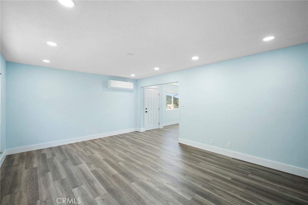7231 Apperson Street Tujunga, CA 91042 - Photo 6 of 20 an empty room with wooden floor and windows