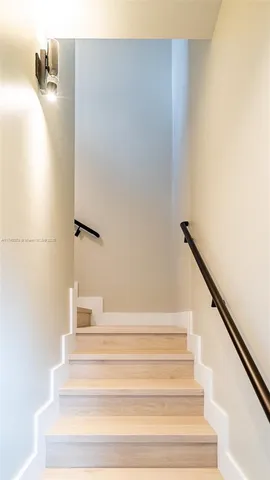 a view of staircase with white walls