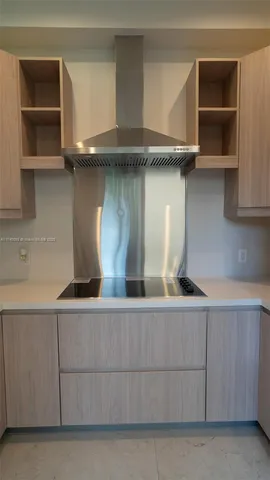 a kitchen with a cabinets and a fireplace