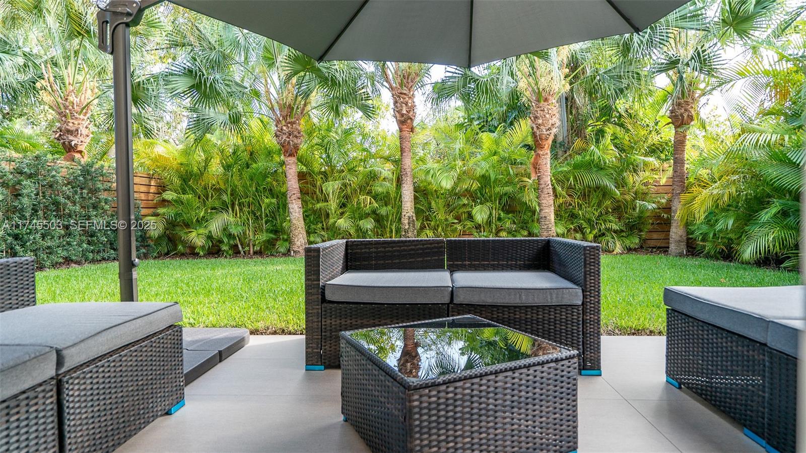 1310 Northeast 117th Terrace, Unit 2 Miami, FL 33161 - Photo 31 of 37 a view of a yard with furniture