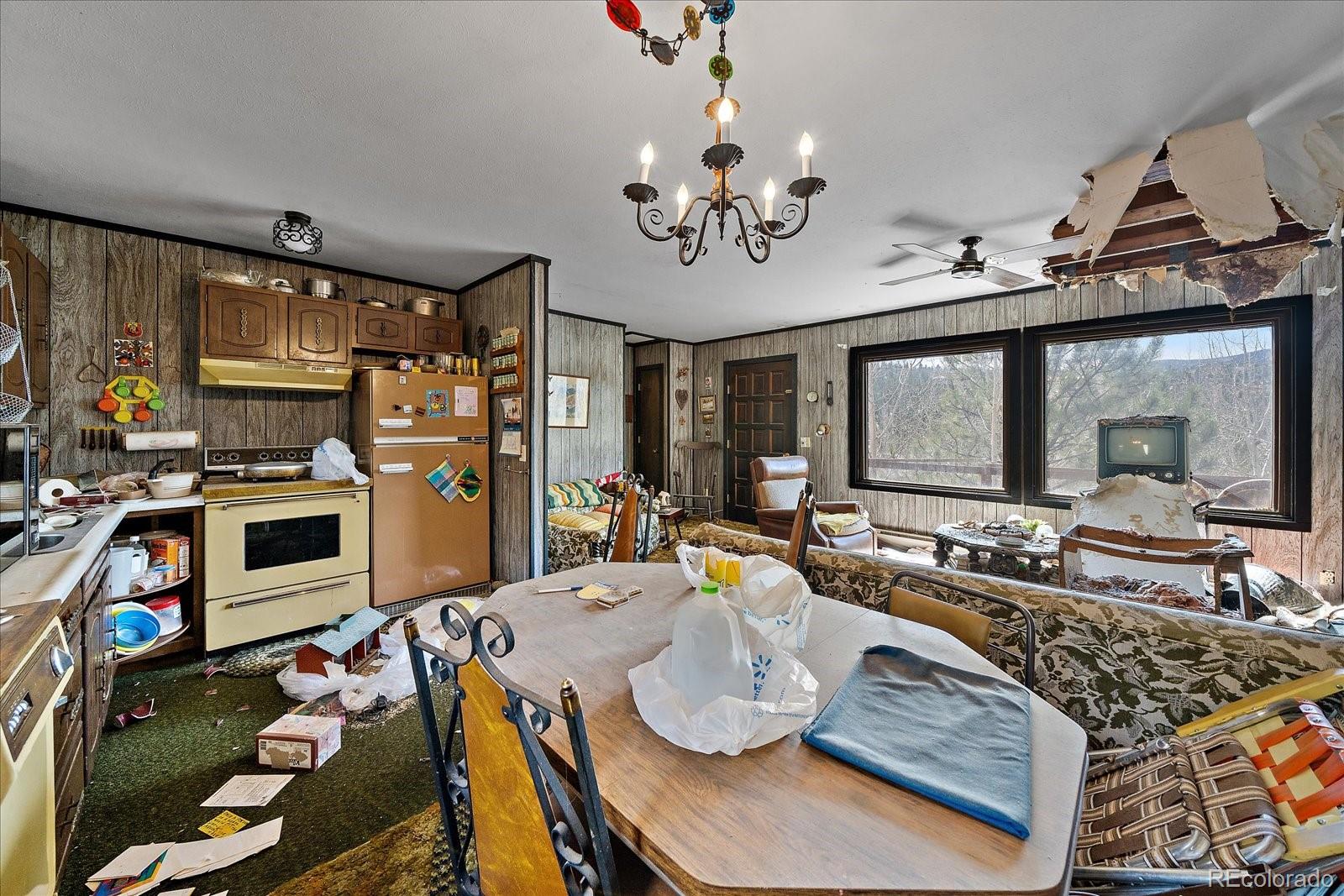 118 Neish Street Bailey, CO 80421 - Photo 7 of 27 a living room with fireplace furniture and a flat screen tv