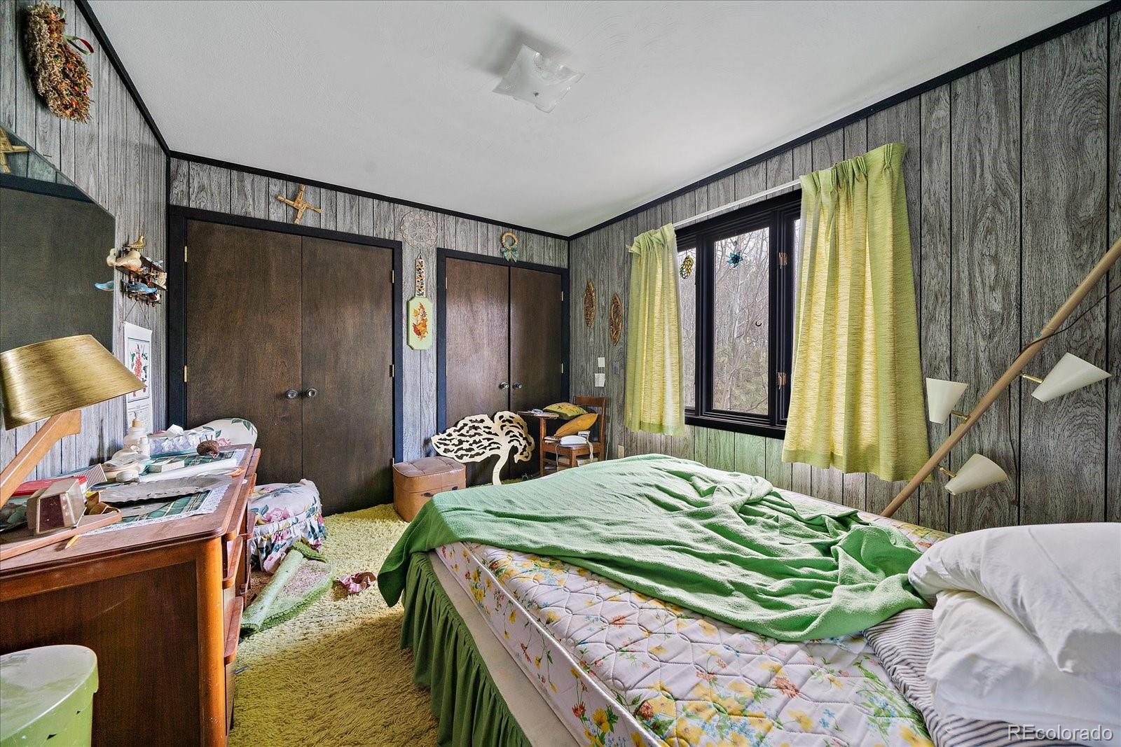 118 Neish Street Bailey, CO 80421 - Photo 10 of 27 a bedroom with bed and a window