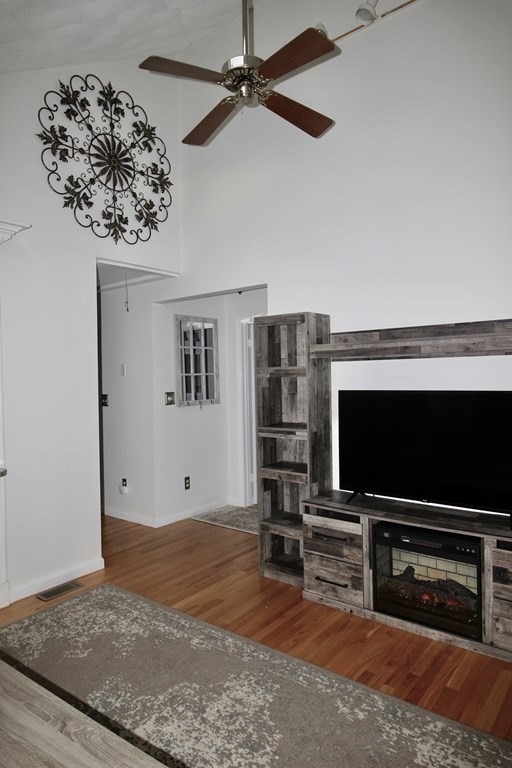133 Hardy Pond Road Waltham, MA 02451 - Photo 9 of 30 a living room with furniture and a flat screen tv