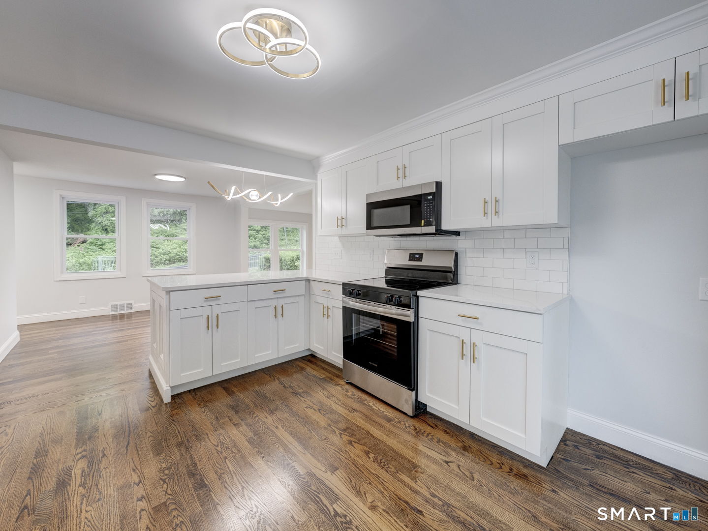 11 Cheshire Road Prospect, CT 06712 - Photo 4 of 38 a kitchen with a white cabinets and wooden floor
