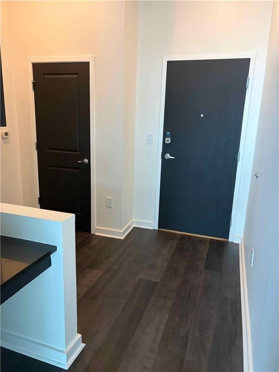 3324 Peachtree Road, Unit 2213 Atlanta, GA 30326 - Photo 7 of 28 an empty room with wooden floor