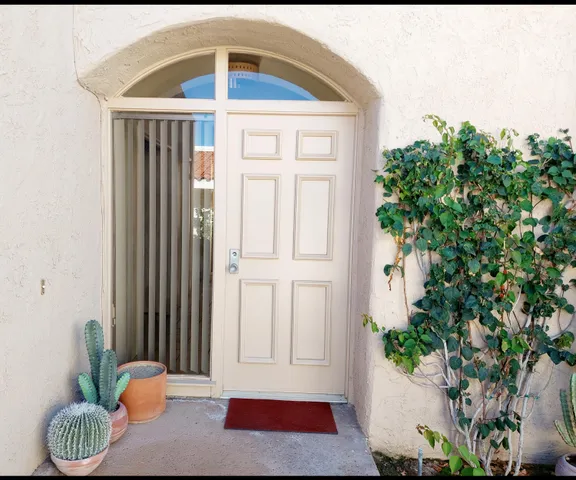 a view of a dining room with furniture and window