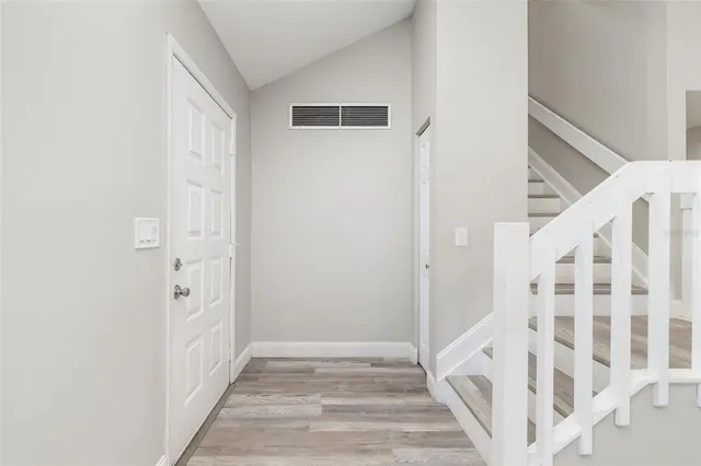 a view of entryway with wooden floor