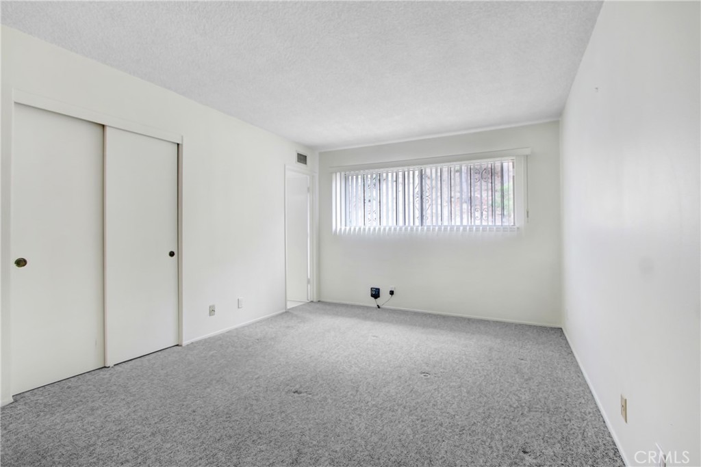 23848 Sunset Crossing Road Diamond Bar, CA 91765 - Photo 17 of 28 an empty room with windows
