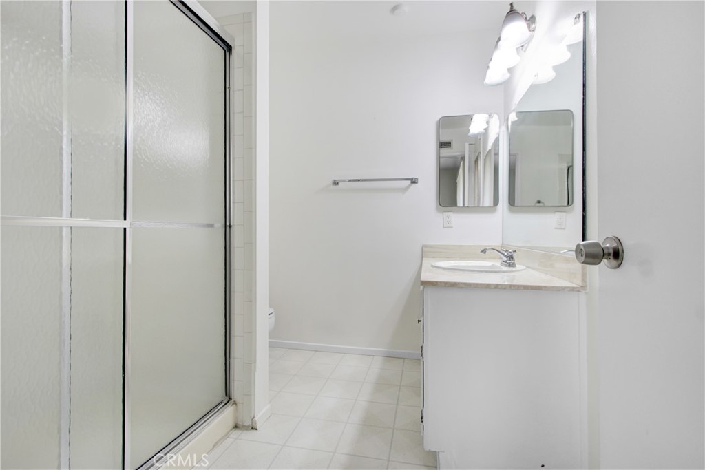 23848 Sunset Crossing Road Diamond Bar, CA 91765 - Photo 19 of 28 a bathroom with a sink and mirror