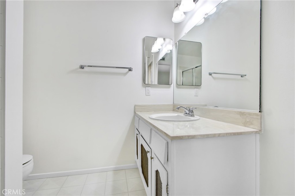 23848 Sunset Crossing Road Diamond Bar, CA 91765 - Photo 20 of 28 a bathroom with a sink and a mirror