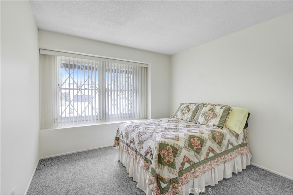 23848 Sunset Crossing Road Diamond Bar, CA 91765 - Photo 22 of 28 a bedroom with a bed next to a window