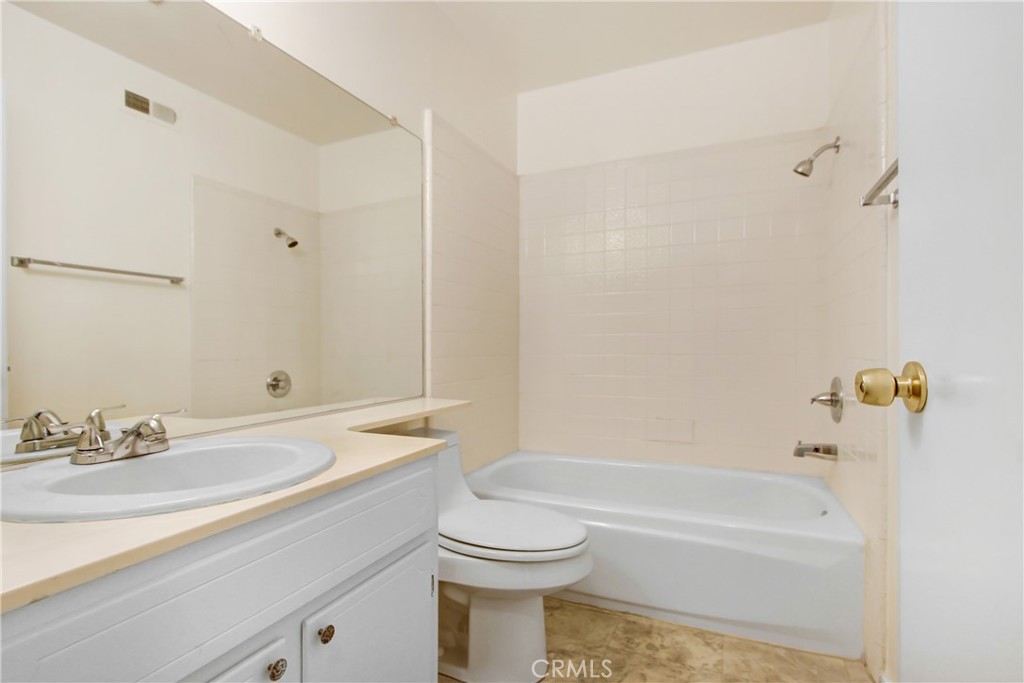 23848 Sunset Crossing Road Diamond Bar, CA 91765 - Photo 23 of 28 a bathroom with a sink a toilet and a bathtub