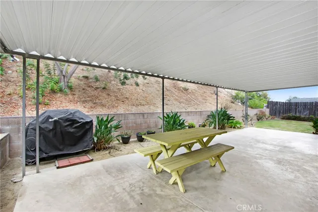 a swimming pool with outdoor seating and yard