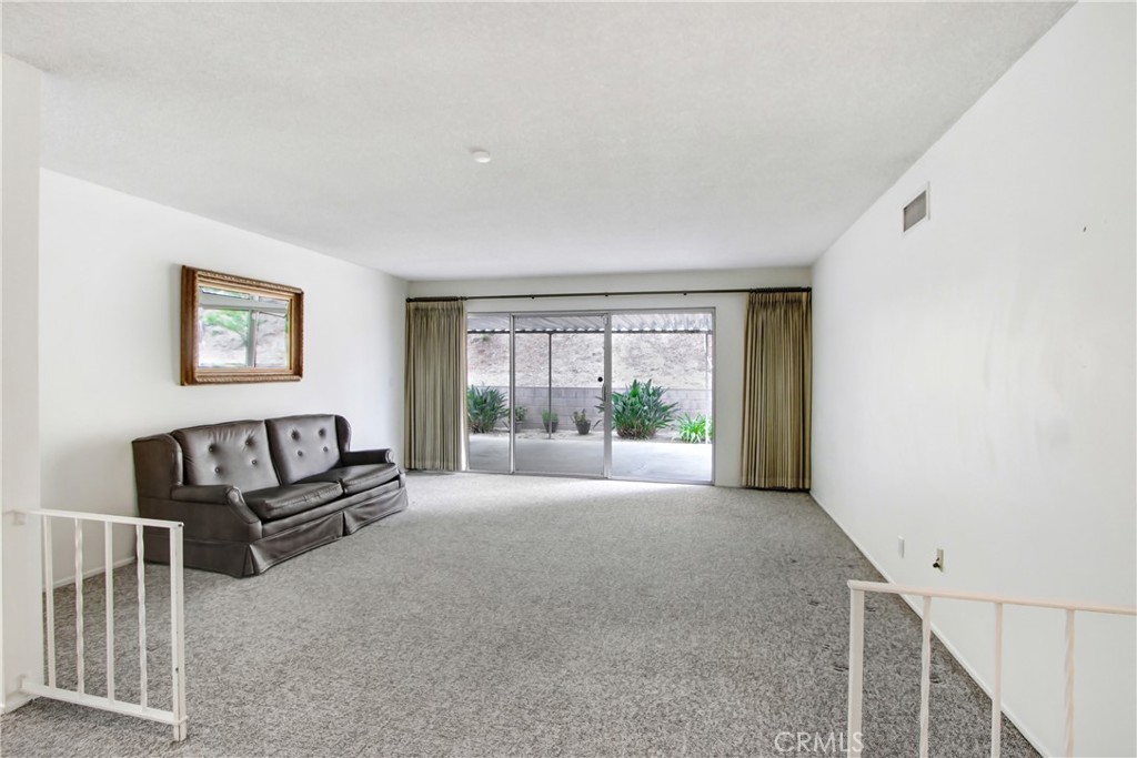 23848 Sunset Crossing Road Diamond Bar, CA 91765 - Photo 4 of 28 a view of a livingroom with furniture wooden floor and window
