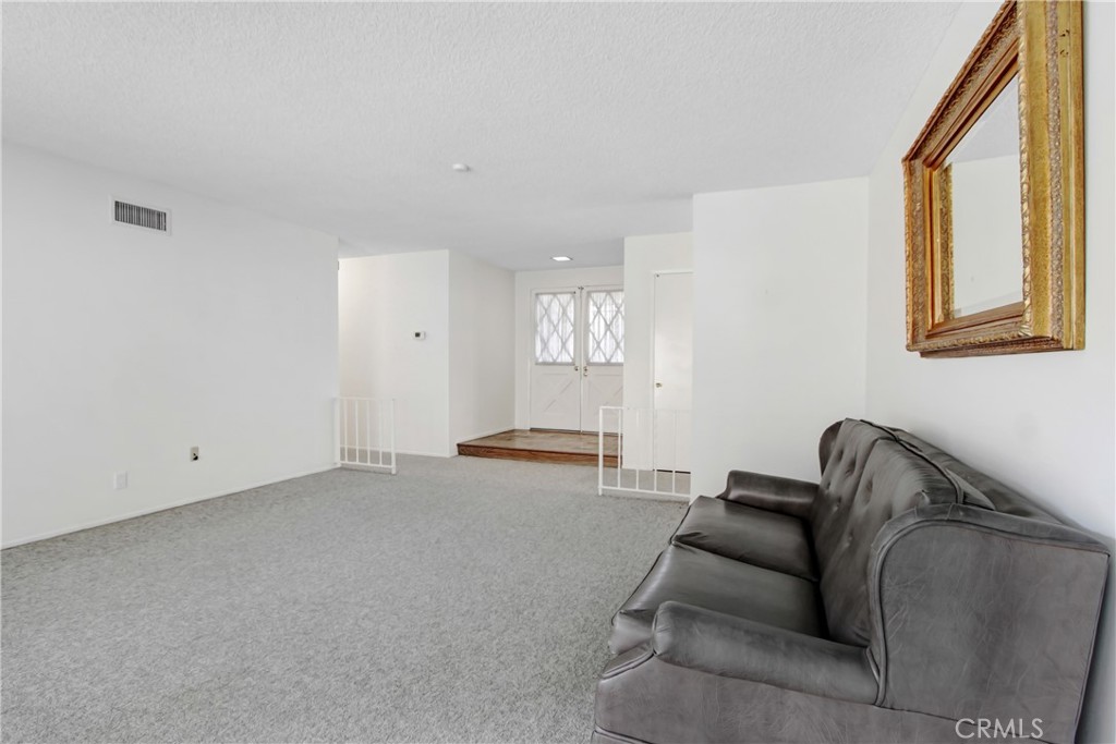23848 Sunset Crossing Road Diamond Bar, CA 91765 - Photo 5 of 28 a living room with furniture and a window