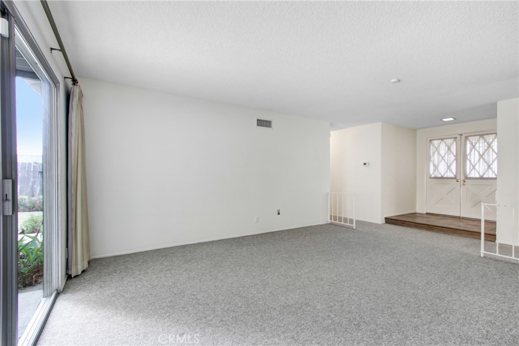23848 Sunset Crossing Road Diamond Bar, CA 91765 - Photo 6 of 28 an empty room with windows