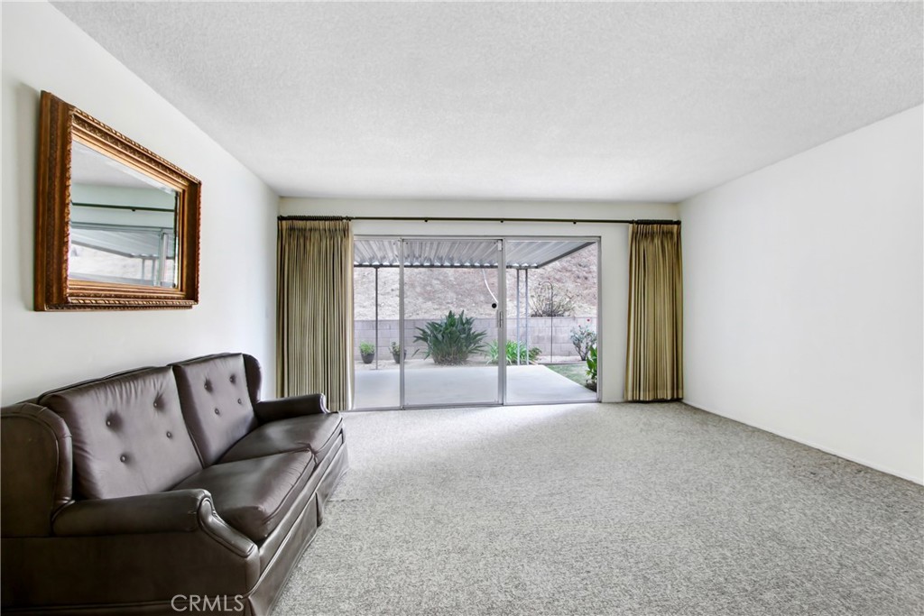 23848 Sunset Crossing Road Diamond Bar, CA 91765 - Photo 7 of 28 a living room with furniture and a large window