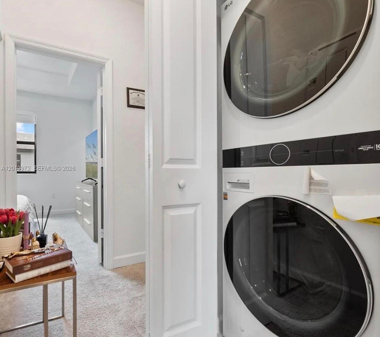 13250 Southwest 285th Street Homestead, FL 33033 - Photo 11 of 13 a close view of a utility room with washer and dryer