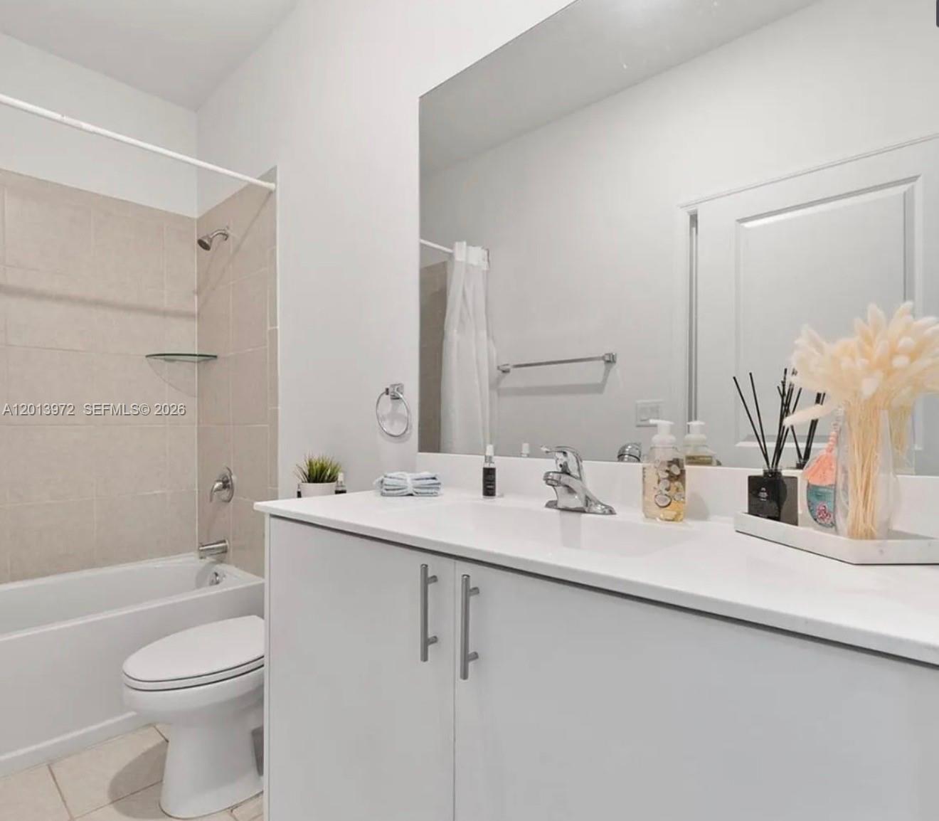 13250 Southwest 285th Street Homestead, FL 33033 - Photo 10 of 13 a bathroom with a double vanity sink toilet and shower