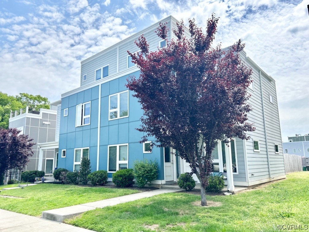1104 Perry Street Richmond, VA 23224 - Photo 1 of 11 a view of a building with a yard