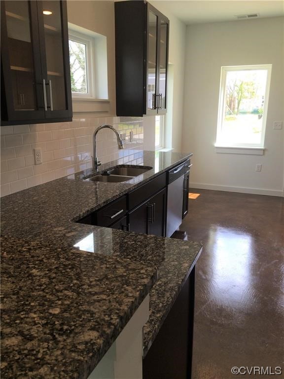 1104 Perry Street Richmond, VA 23224 - Photo 6 of 11 a kitchen with granite countertop a sink and a stove
