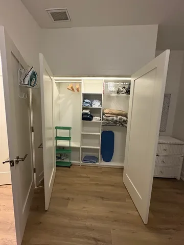 a kitchen with stainless steel appliances granite countertop a refrigerator and a stove