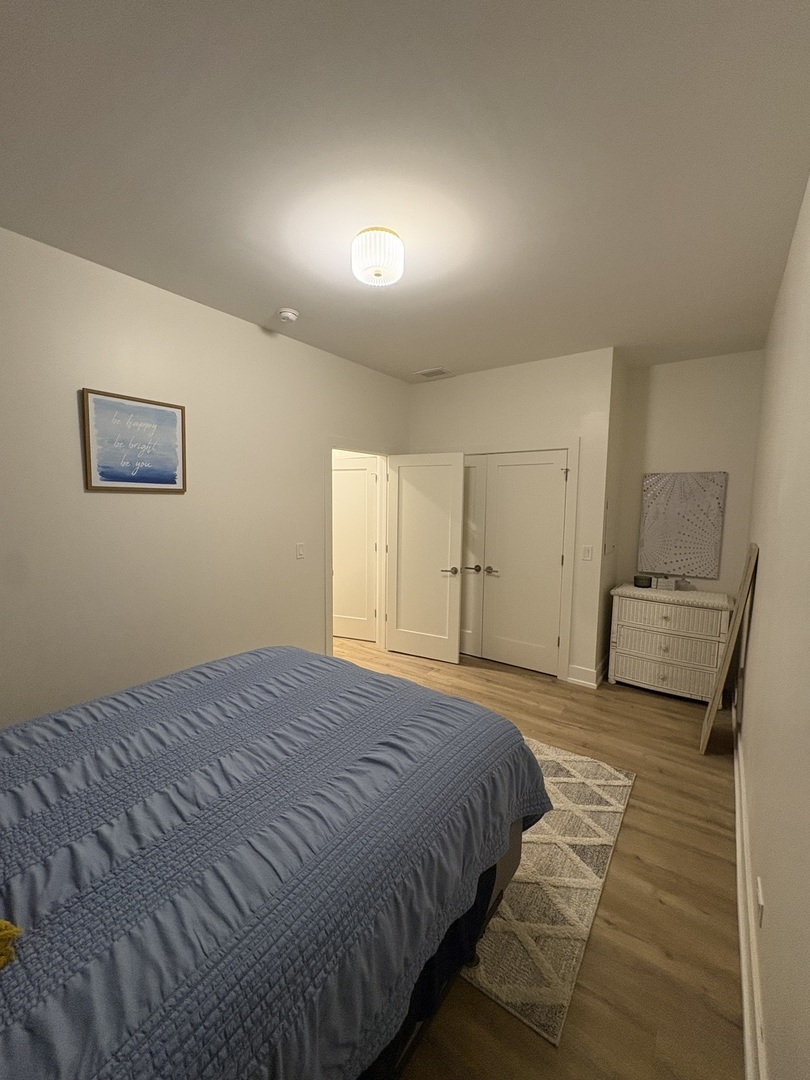 6317 South Rhodes Avenue, Unit G Chicago, IL 60637 - Photo 14 of 14 a bedroom with a bed and a walk in closet