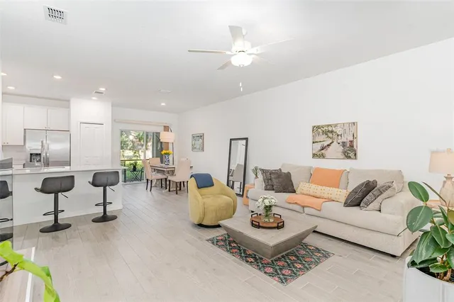 a living room with furniture and white walls