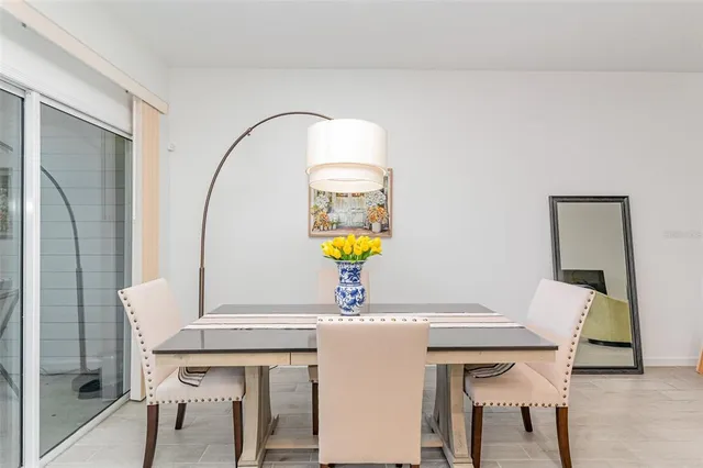 a living room with a table and chairs